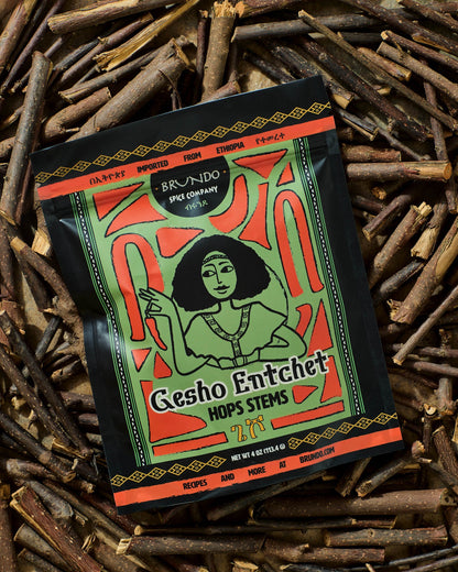 Brundo Spice Company Gesho Entchet Ethiopian hops stems pouch displayed on a bed of dried hop stems.